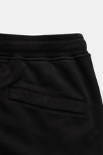 Close-up top view of Stone Island Cargo-Sweatshorts 'Felpa' schwarz showing black cotton fabric with a soft grip, elastic waistband, and back welt pocket.

<p>Maximale Lässigkeit kommt mit den bequemen Sweatshorts 'Felpa' von STONE ISLAND aus reiner Baumw