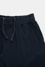 Close-up front view of 04651/ A trip in a bag 'Terry' shorts navy, showing elastic waistband with drawstring and French pockets.

Description: <p>With the model 'Terry' 04651/ A TRIP IN A BAG presents a comfortable pair of shorts in wonderfully soft terry