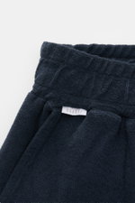 Close-up front view of 04651/ A trip in a bag 'Terry' shorts navy made of soft pure cotton terrycloth with elasticated waistband.

Description: <p>With the model 'Terry' 04651/ A TRIP IN A BAG presents a comfortable pair of shorts in wonderfully soft terr