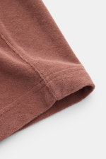 Nahaufnahme der rostbraunen 04651/ A trip in a bag Frottee-Shorts 'Terry' aus weichem Baumwoll-Frottee, Regular Fit mit elastischem Bund.