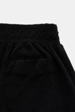 04651/ A trip in a bag Frottee-Shorts 'Terry' schwarz, Detailansicht von hinten oben mit elastischem Bund, Gesäß-Leistentasche, weichem Baumwoll-Frottee.