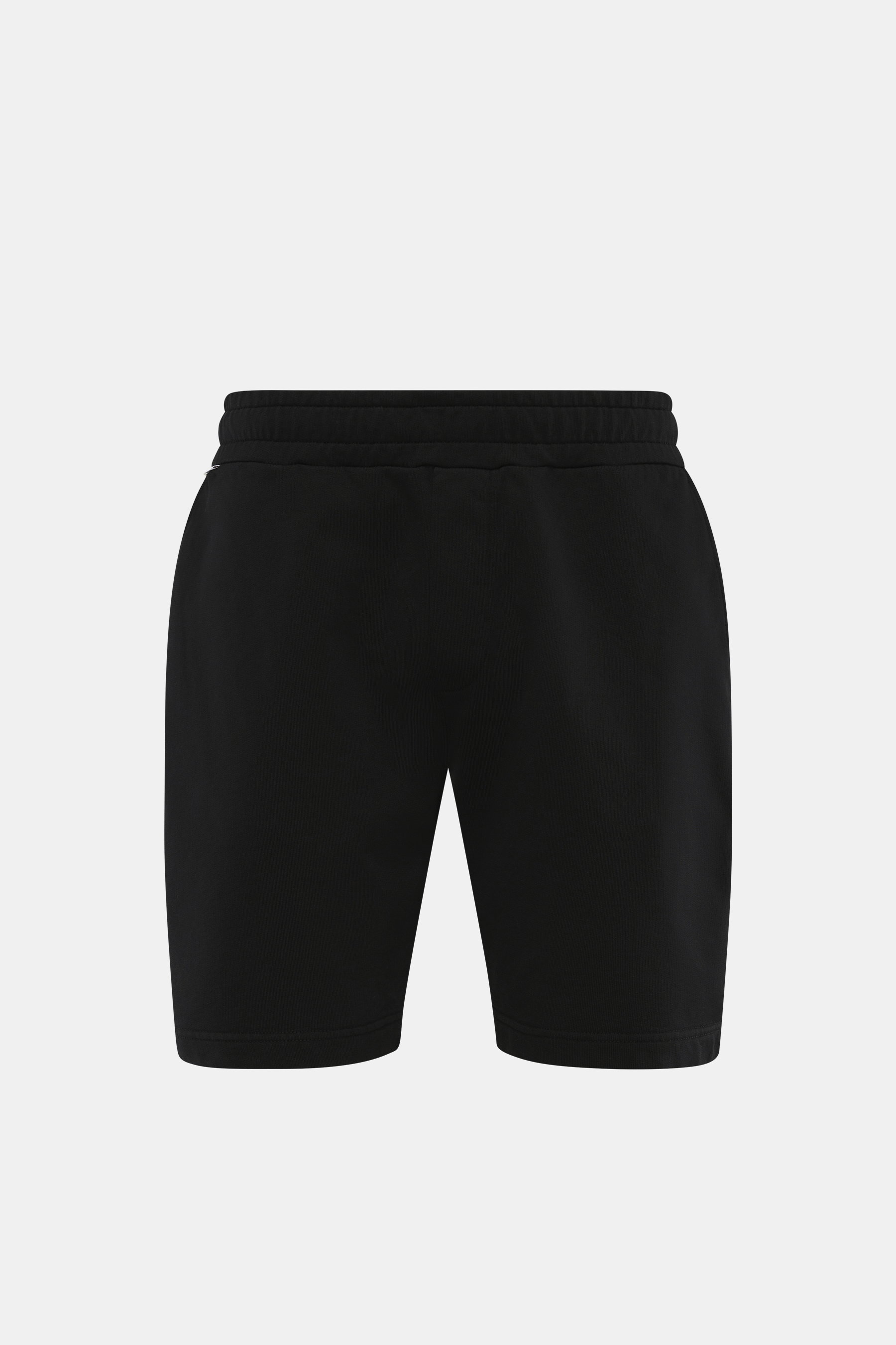 Front view of 04651/ A trip in a bag Sweatshorts 'Studio' black in heavy quality pure cotton sweatshirt fabric, soft feel, slim fit, elastic waistband with drawstring, suggested fly, French pockets, welt pocket on the back, and small woven label.