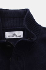 Close-up front view of the Stone Island Half-zip jumper 'Lambswool' navy, showing its warm wool blend, half-zip collar with embossed buttons, ribbed knit, and brand label. 

<p>A stylish essential for the colder months: This timeless half-zip jumper by ST
