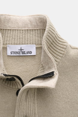 Close-up front view of Stone Island Half-zip jumper 'Lambswool' taupe showing half-zip collar with buttons, knit texture, and label. A stylish essential for the colder months: This timeless half-zip jumper by STONE ISLAND with zip and embossed buttons on 