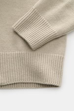 Close-up front view of the Stone Island Half-zip jumper 'Lambswool' taupe, showing ribbed elasticated cuffs and hem in a soft wool blend knit.

<p>A stylish essential for the colder months: This timeless half-zip jumper by STONE ISLAND with zip and emboss