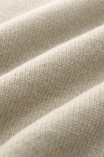 Close-up fabric texture of Stone Island Half-zip jumper 'Lambswool' taupe, showing soft wool blend knit with medium-fine stitches from a top-down angle, highlighting warmth and quality.

Description: <p>A stylish essential for the colder months: This time