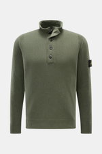 Stone Island Half-zip jumper 'Lambswool' olive shown from the front, slim fit with half-zip collar, embossed buttons, ribbed bands, and signature badge. 

A stylish essential for the colder months: This timeless half-zip jumper by STONE ISLAND with zip an