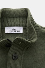 Stone Island Half-zip jumper 'Lambswool' olive shown from above, highlighting half-zip collar with embossed buttons and textured knitwear.