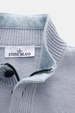 Close-up front view of Stone Island Half-zip jumper 'Lambswool' smoky blue showing half-zip collar with embossed buttons, knitwear texture, and label.

Description: <p>A stylish essential for the colder months: This timeless half-zip jumper by STONE ISLAN