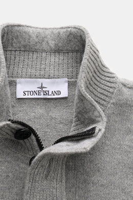 Stone Island Half-zip jumper 'Lambswool' grey melange shown from a close-up top front view, featuring a half-zip collar with embossed buttons, knitted wool blend with soft medium-fine knit, ribbed bands, contrasting knit stripes, and the signature compass