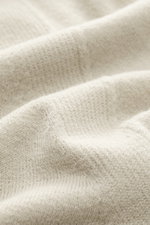 Close-up front view of the Stone Island Half-Zip Jumper beige showing fine knit pattern, soft touch virgin wool and microfiber fabric.

Additional description: <p>Comfort meets style: The STONE ISLAND half-zip jumper complements your autumn wardrobe with 