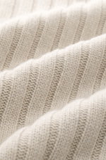 Close-up front view of the fine knit pattern and soft ribbed texture of the Belstaff Troyer 'Lincoln' beige wool-cashmere sweater.

<p>The soft Troyer 'Lincoln' is made from wool with a smooth cashmere content and is part of the 'Phoenix' Capsule Collecti