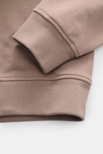 Close-up front view of the cuff and waistband of the Belstaff Sweat half-zip jumper 'Quarter Zip' taupe, showing sweat fabric made of cotton, soft feel, slim fit, half-zip collar, BELSTAFF woven label on the chest, and flexible ribbed bands.