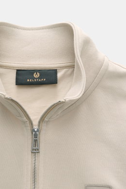 Close-up front view of Belstaff Sweat half-zip jumper 'Quarter Zip' beige, showing half-zip collar, BELSTAFF woven label, sweat fabric made of cotton with soft feel, slim fit, and flexible ribbed bands.