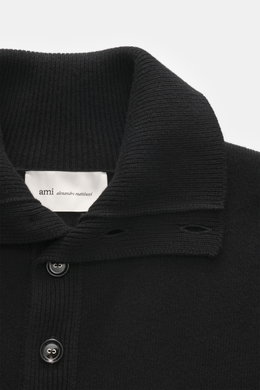 Close-up front view of Ami Paris Merino sweater black, showcasing troyer collar with 5-button placket, pure merino wool, soft feel, regular fit, back yoke with logo patch, and comfortable ribbed cuffs.