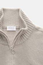Close-up front view of 04651/ A trip in a bag Cashmere quarter-zip jumper 'Extreme' taupe, showing pure cashmere, very soft feel, fine knit pattern, slim fit, sweater collar with zipper, and flexible ribbed cuffs.