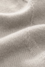 Close-up front view of 04651/ A trip in a bag Cashmere quarter-zip jumper 'Extreme' taupe showing pure cashmere, very soft feel, fine knit pattern, slim fit, sweater collar with zipper, and flexible ribbed cuffs.