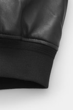 Close-up of the elastic cuff on the sleeve of the Belstaff Leather Blouson 'Marker Jacket' black, photographed from a side angle. The leather blouson "Marker Jacket" is the perfect jacket for autumn – soft sheepskin leather and the casual chic emphasize t