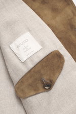 Close-up front view of the Rifugio Brown suede leather jacket showing supple suede leather, button cuff, and interior label. 

<p>A statement of finest leather craftsmanship: The suede leather jacket by RIFUGIO impresses with its velvety-soft feel and cle