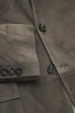 Close-up front view of the Rifugio Suede Blazer Dark Grey showing supple suede leather, buttons, and patch pocket with flap, Slim Fit.