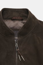 Close-up front view of Windsor Velour leather blouson 'Borello' dark brown showing soft goat velour leather, stand-up collar, two-way zipper, and smooth lining. Soft feel, light padding, slim fit, angled welt pockets, small metal logo on the back, knitted