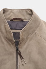 Close-up front view of Windsor Velour leather blouson 'Borello' taupe showing soft goat velour leather, soft feel, light padding, slim fit, stand-up collar, two-way zipper, angled welt pockets, small metal logo on the back, knitted elastic cuffs, smooth l