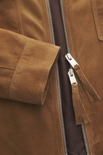 Close-up front view of the Arma Suede leather jacket 'Kale' brown showing soft suede leather, two-way zipper, and sleeve cuff details, slim fit.