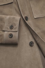 Close-up front view of Arma Velour leather jacket 'Mex' taupe showing noble lamb velour leather, soft touch, five-button placket, turn-down collar, chest pockets with flaps, slanted welt pockets, and sleeve cuffs with button, unlined and regularly fitted.