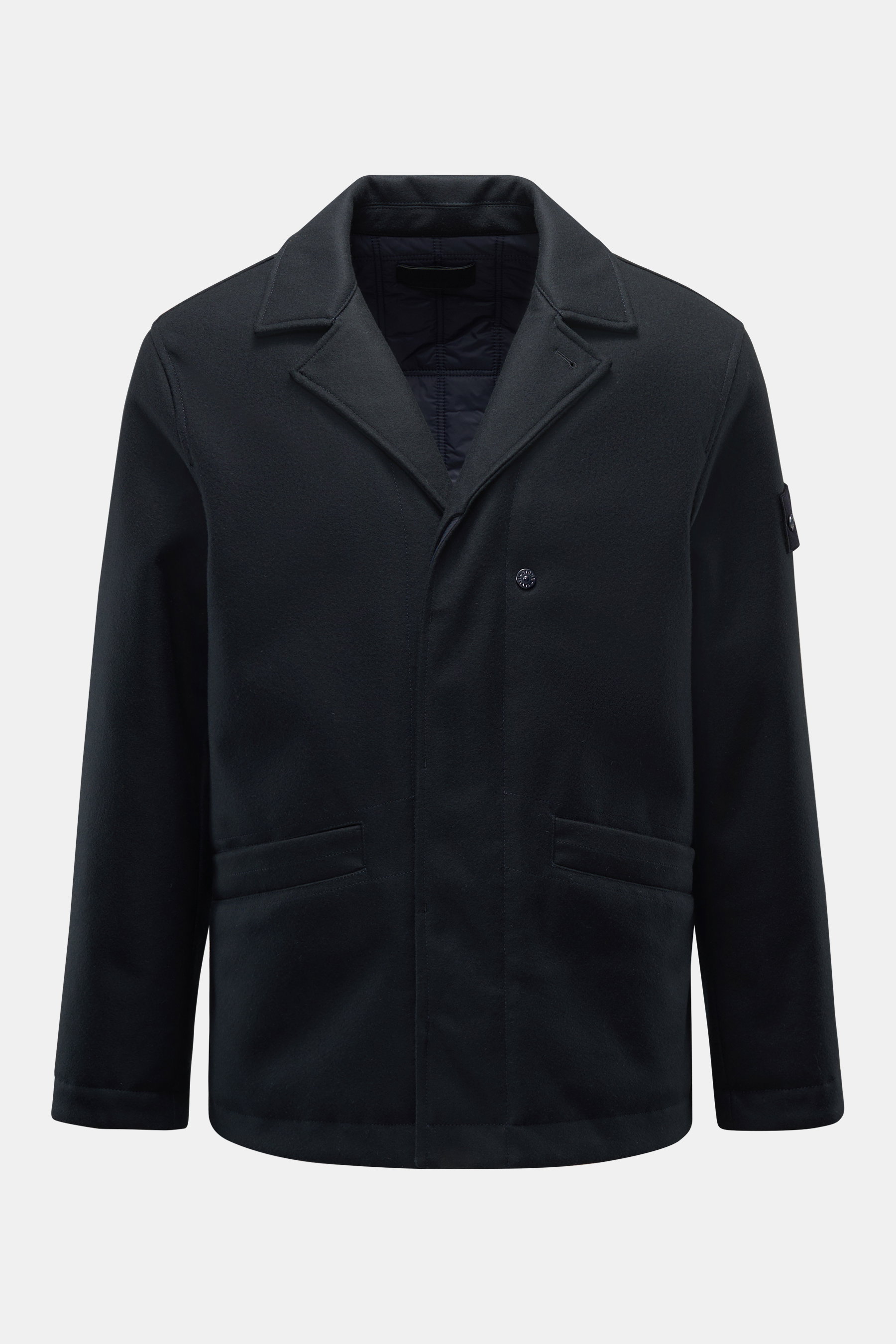 Stone Island Jacke 'Ghost Piece' navy front view showing wool-mix slim fit jacket with soft feel, Primaloft fill, button placket, tonal badge, and angled pockets. <p>Die Jacke aus der monochrom gestalteten, vom Konzept der Tarnung inspirierten 'Ghost Coll