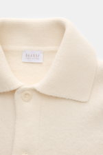 Close-up front view of the creme 04651/ A trip in a bag Woll-Overshirt 'Boiled Blouson' showing collar, buttons, and fabric texture. <p>Boiled Blouson</p>