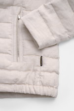 Close-up front view of the Moorer Down jacket 'Alec' beige melange showing quilted pure linen fabric, two-way zip, and elastic hem. This elegant quilted jacket 'Alec' by MOORER will see you through the changing seasons in style. The lightweight down linin