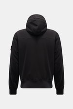 Rear view of Stone Island Blouson 'Light Soft Shell-R' black soft shell jacket with hood, elastic hem, slim fit, and compass badge on sleeve.