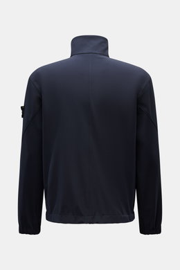 Rear view of Stone Island Jacket 'Light Soft Shell-R' navy, slim fit with standing collar, elasticated cuffs, and compass badge on sleeve.