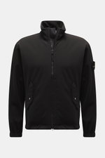 Stone Island Jacket 'Light Soft Shell-R' black shown front view, slim fit soft shell with standing collar, flap pockets, elasticated cuffs, compass badge. Style meets function: This soft shell jacket by STONE ISLAND has a sporty design in a three-layer fu
