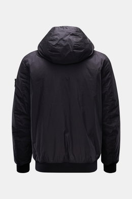 Rear view of Stone Island Jacket 'Garment Dyed Crinkle Reps NY' dark navy, lightweight microfibre with padded hood and elastic cuffs.