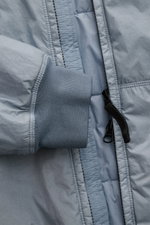 Close-up front view of Stone Island Blouson 'Garment Dyed Crinkle Reps NY' rauchblau showing sleeve cuff, zipper, and textured microfiber fabric with crinkle effect.