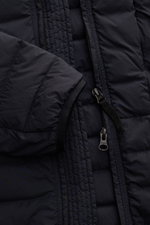 Close-up front view of Stone Island Daunenjacke 'Seamless Tunnel Nylon Down-TC' dark navy showing zipper, sleeve cuff, and quilted nylon fabric with lightweight down fill. The jacket features high-quality microfiber, slight stretch, smooth feel, garment d