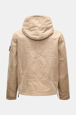 Rear view of Stone Island Jacke 'Organic-Look Nylon Panama-TC' beige, made of high-quality microfiber canvas with a water-repellent coating, featuring a hood with drawstring, elastic cuffs, and adjustable hem.

<p>Mit der Jacke 'Organic-Look Nylon Panama-