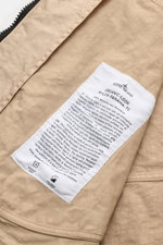 Close-up view of the inside label on the beige Stone Island Jacke 'Organic-Look Nylon Panama-TC', highlighting fabric details and care instructions. 

<p>Mit der Jacke 'Organic-Look Nylon Panama-TC' präsentiert STONE ISLAND ein modernes Modell aus dicht g