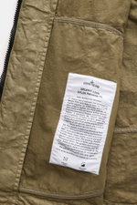 Close-up inside view of Stone Island Jacke 'Organic-Look Nylon Panama-TC' oliv showing fabric label and stitching details.

Description: <p>Mit der Jacke 'Organic-Look Nylon Panama-TC' präsentiert STONE ISLAND ein modernes Modell aus dicht gewebtem Microf