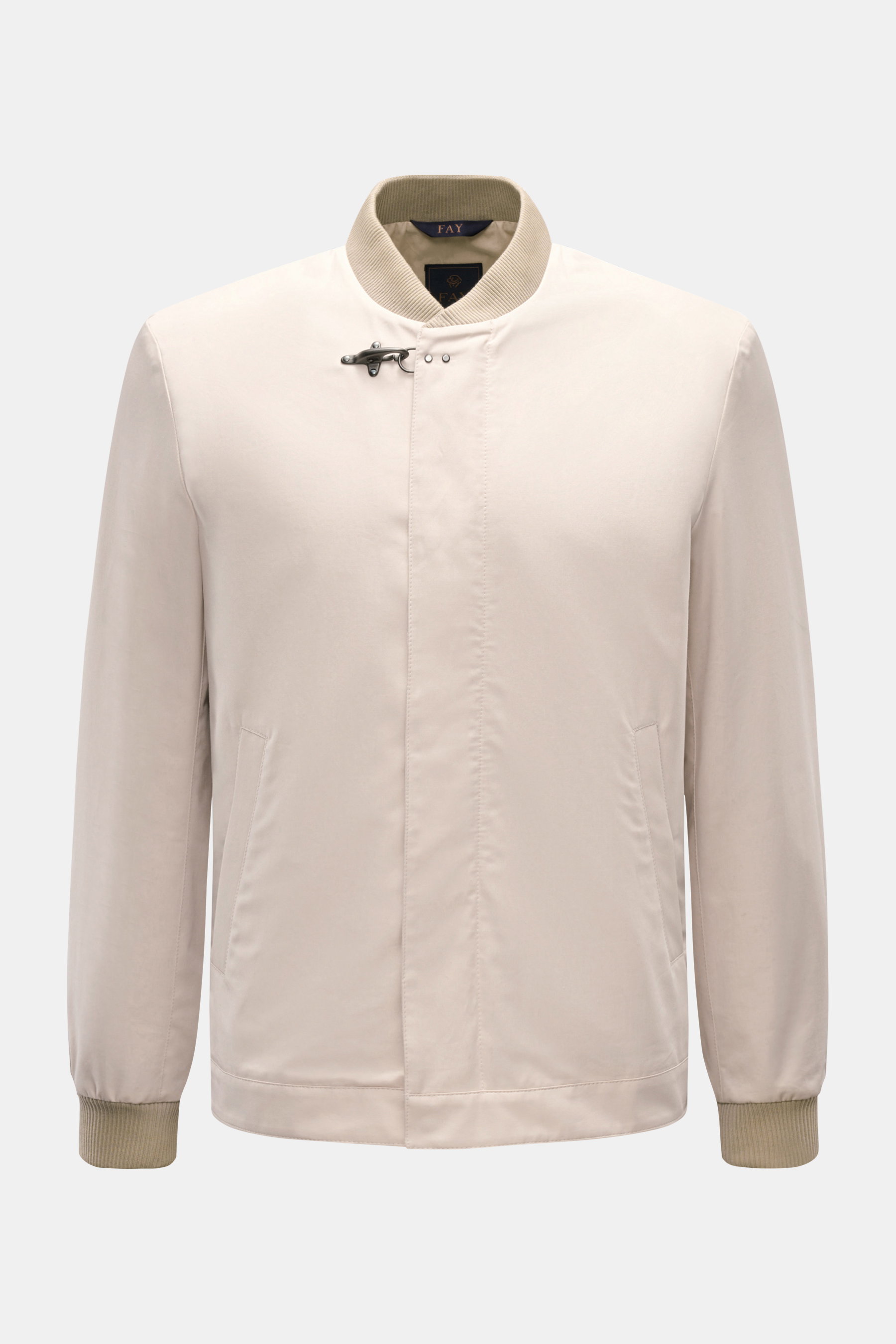 Front view of Fay Blouson beige, a slim fit jacket with rib knit collar and cuffs, two-way zip, storm flap with snap buttons, signature carabiner closure, slanted hip pockets, smooth lining, and one inside pocket, made from a luxurious blend of cotton, si
