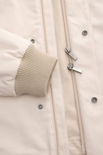 Close-up front view of the Fay Blouson beige showing rib knit elasticated cuff, two-way zip with signature carabiner closure, storm flap with snap buttons, and smooth cotton, silk, and cashmere blend fabric. A luxurious all-rounder for the transitional pe