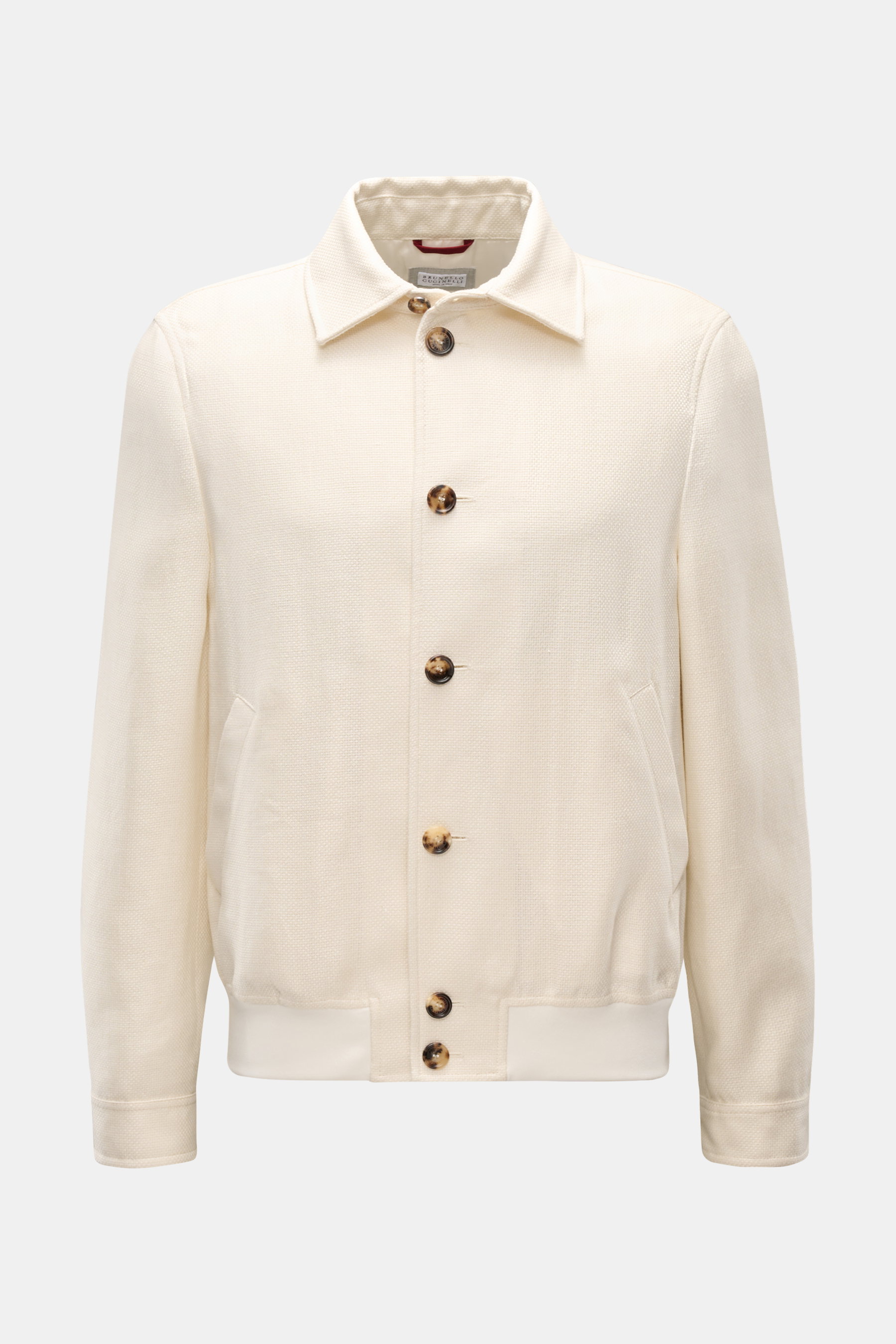Brunello Cucinelli Blouson creme, Slim Fit, mit Umlegekragen, Sieben-Knopf-Leiste, schräge Taschen, Manschetten, elastischem Saum, leichte Webstruktur, Vorderansicht.