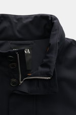 Zegna Jacket 'Motorino' navy close-up from above showing the high-quality microfibre collar with buttons, two-way zip, and tonal wool lining. <section class="text-token-text-primary w-full focus:outline-none [--shadow-height:45px] has-data-writing-block:p
