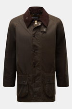 Front view of Barbour Waxed jacket 'Beaufort' dark olive in waxed cotton with corduroy collar, snap buttons, patch pockets, and two-way zip.

Description: A true classic from BARBOUR: The long waxed jacket 'Beaufort' made of water repellent, waxed cotton 
