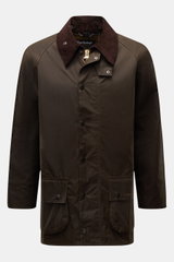Front view of Barbour Waxed jacket 'Beaufort' dark olive in waxed cotton with corduroy collar, snap buttons, patch pockets, and two-way zip.

Description: A true classic from BARBOUR: The long waxed jacket 'Beaufort' made of water repellent, waxed cotton 