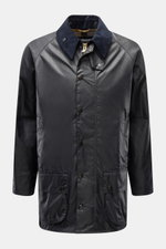Front view of Barbour Waxed jacket 'Beaufort' dark navy in waxed cotton with corduroy collar, patch pockets, and water-repellent finish.

Description:
<p>A true classic in the British outdoor tradition: The waxed jacket 'Beaufort' by BARBOUR is made of ro