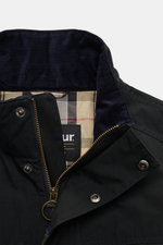Close-up front view of Barbour Field jacket 'Sanderling' navy showing a lightweight cotton-microfibre blend fabric, velvety corduroy collar, robust two-way zip, storm flap with snap buttons, and classic tartan half lining. Lightweight, functional, and cla