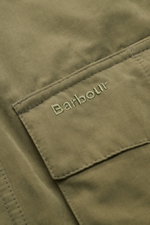 Close-up front view of the Barbour Field jacket 'Sanderling' olive showing embroidered logo on a pocket of lightweight cotton and microfiber fabric.
