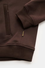 Close-up front view of the Moorer Sweat jacket 'Crispin Felpa' dark brown showing the pocket, elastic sleeve cuff, and fabric texture, sporty and elegant for warm days with a cotton-microfibre blend, soft feel, slim fit, two-way zip, standing collar, zip 
